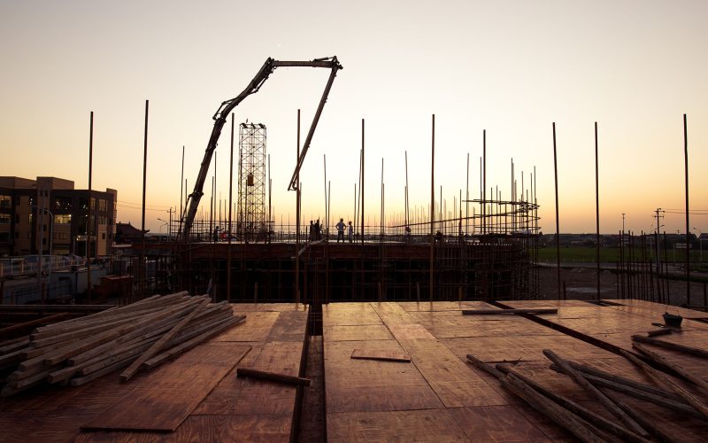 steel structure on construction site in colorful sky at dawn